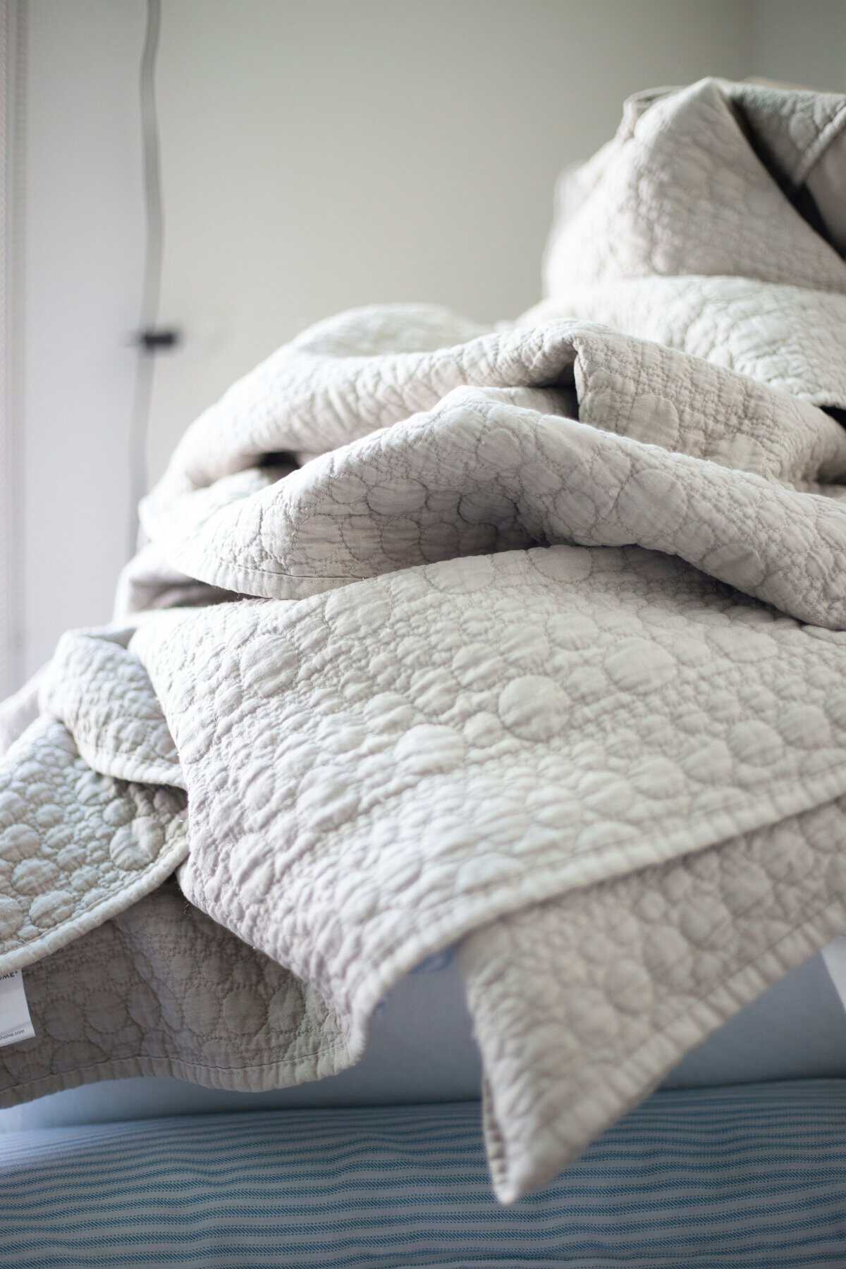 Coastal Living Collection mood photo showing a soft, light quilt